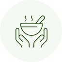 Hands holding steaming bowl with spoon.