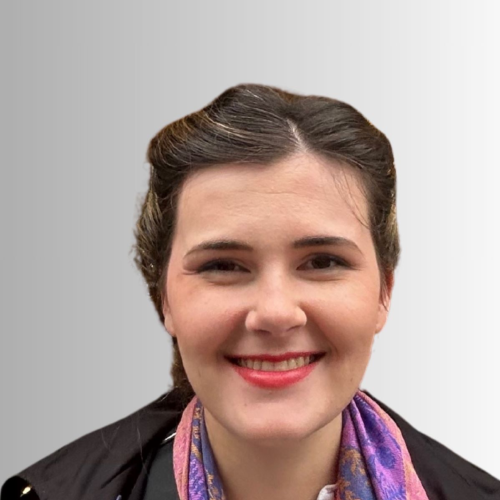 Portrait of a smiling woman with dark hair and a colorful scarf.